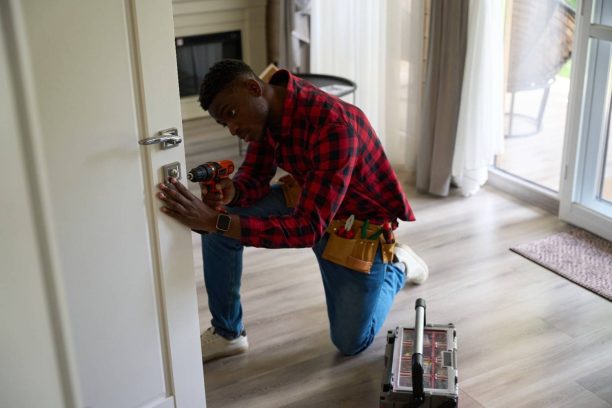 cute-housekeeper-is-repairing-a-wooden-door-2024-10-21-21-02-43-utc (1) Locksmith service